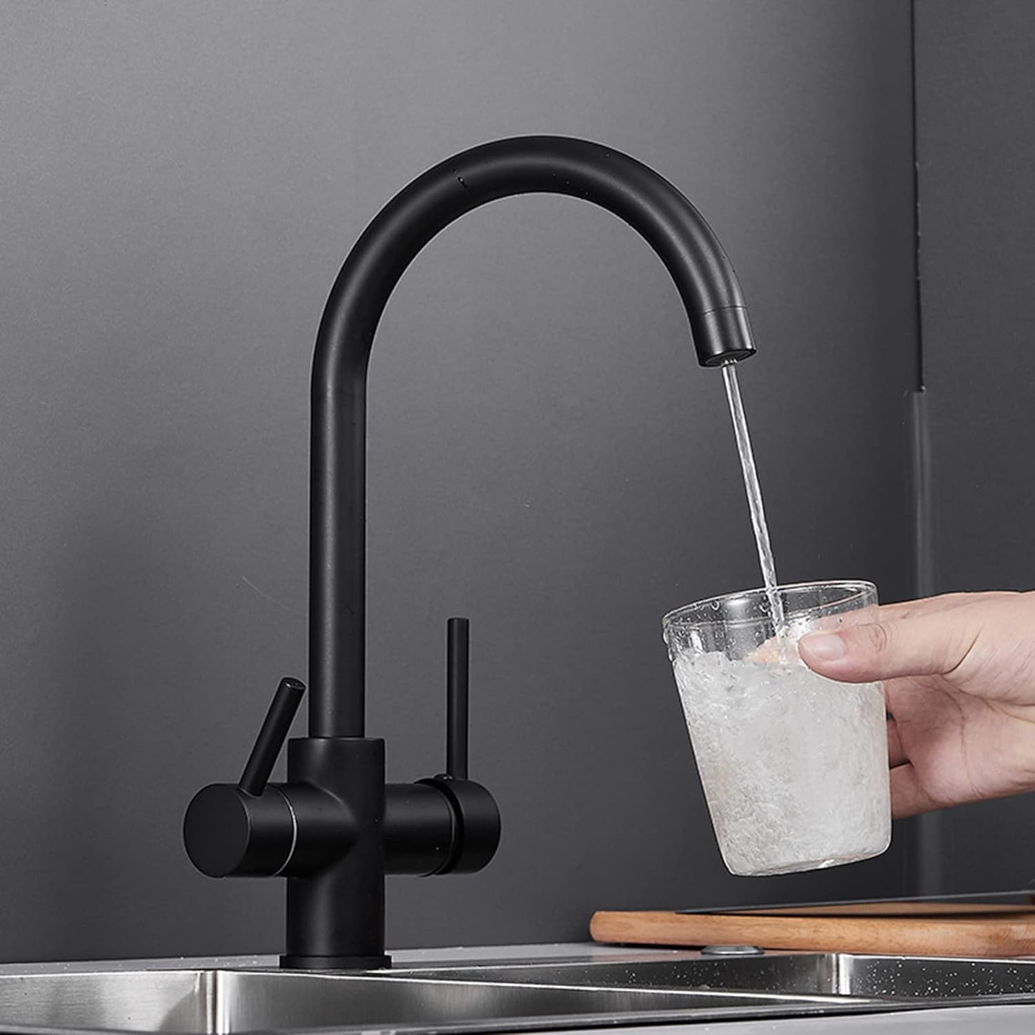 Kitchen faucet pouring water with ro dispenser