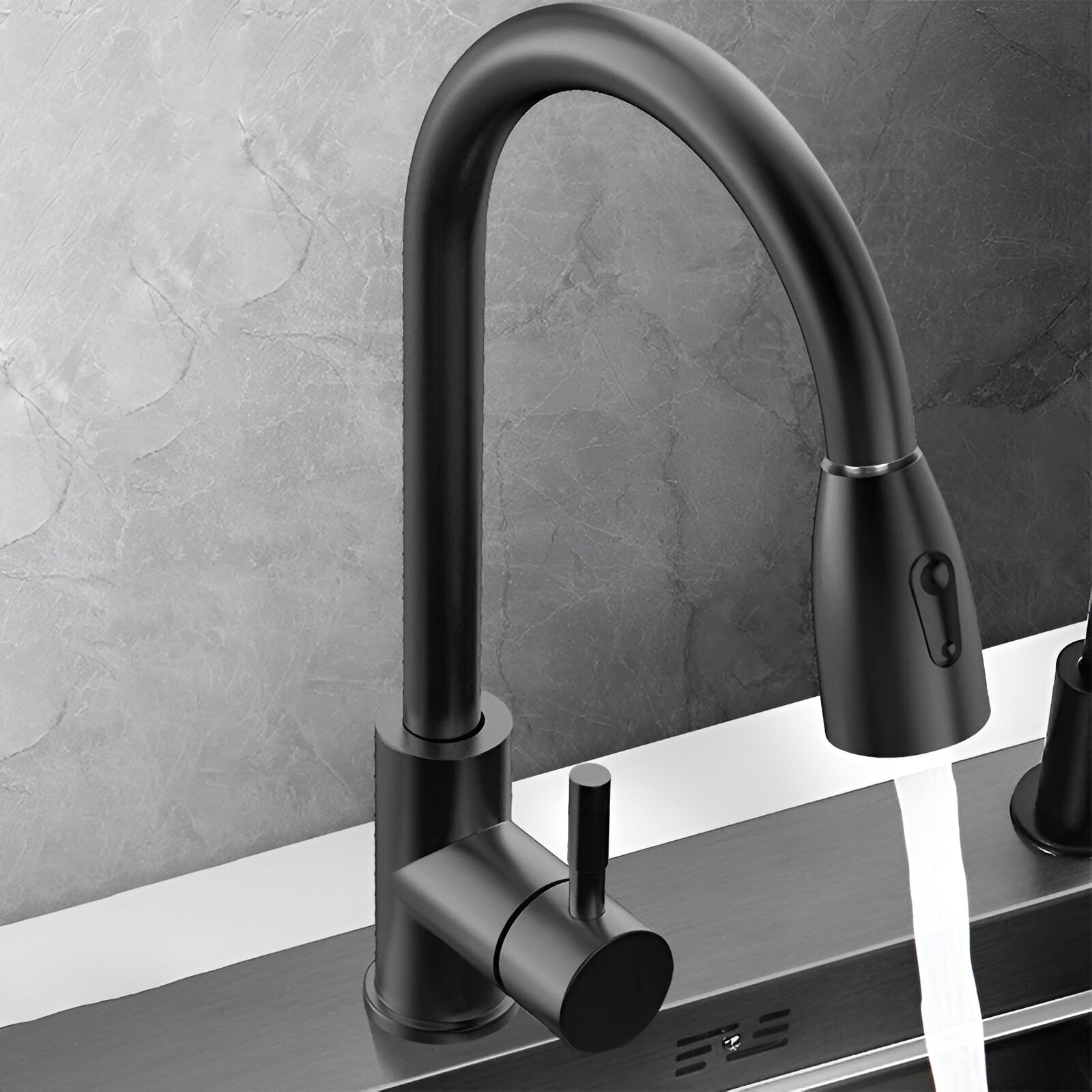 Black faucet with 3 modes on a kitchen workstation sink