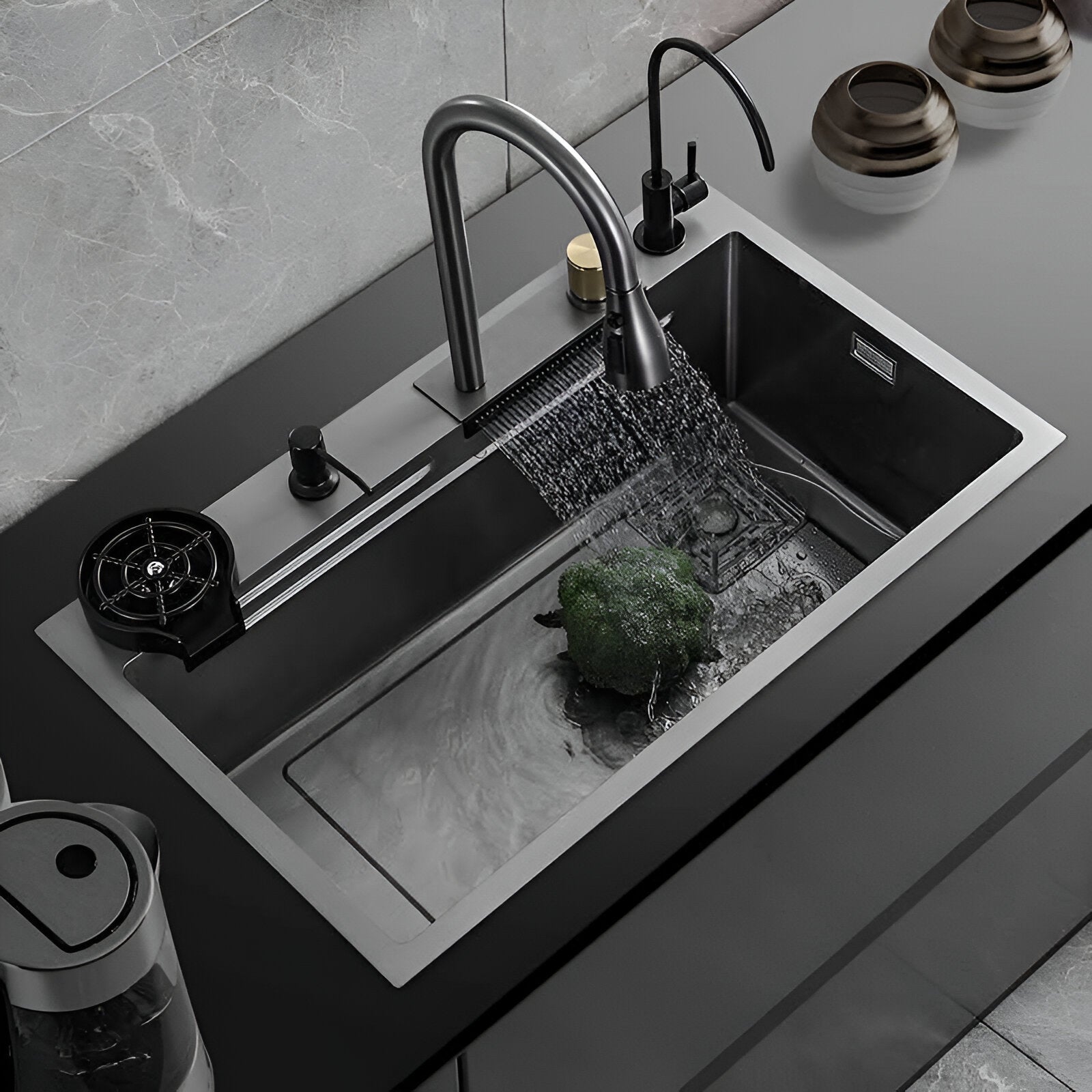 Black kitchen workstation sink with 2 faucets and waterfall mode