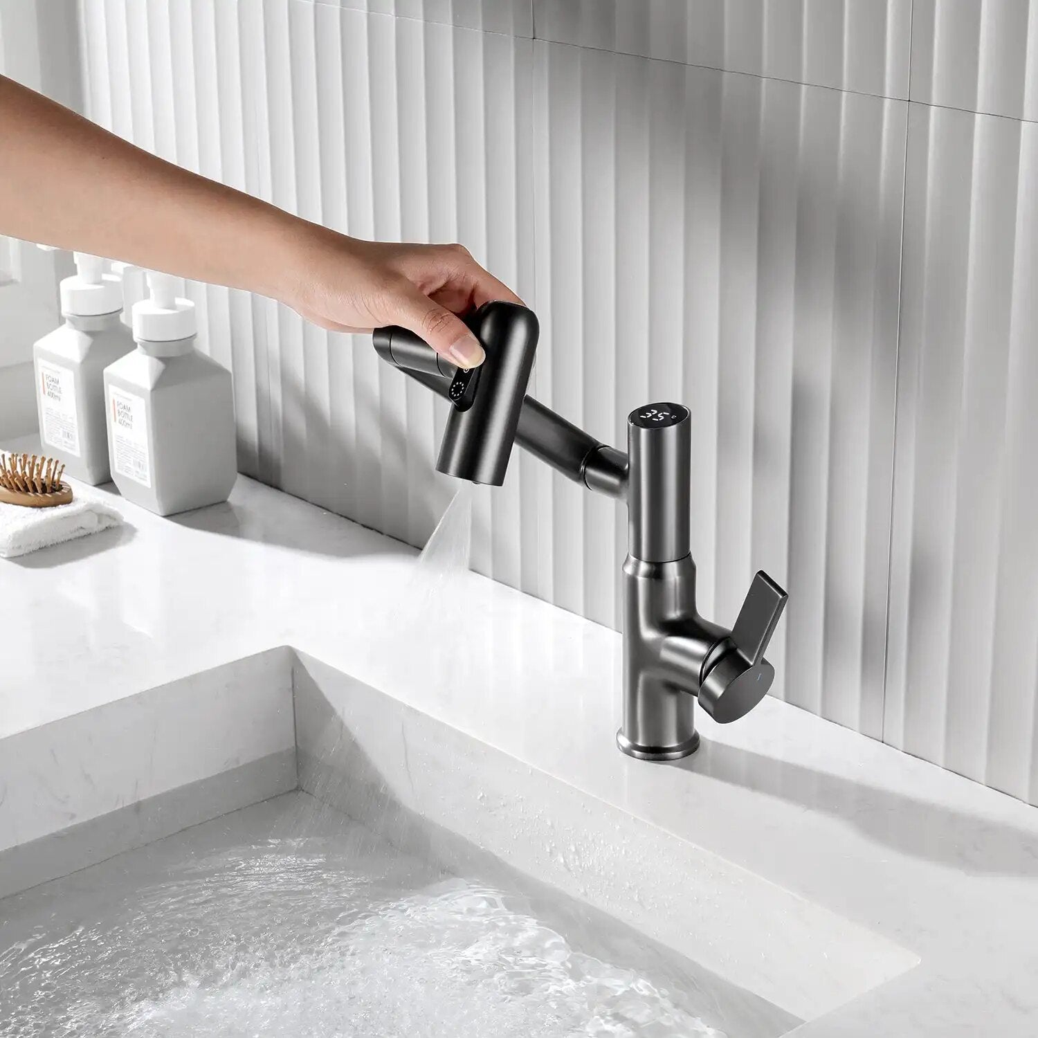 User changing modes of the Gray Leiden faucet outlet