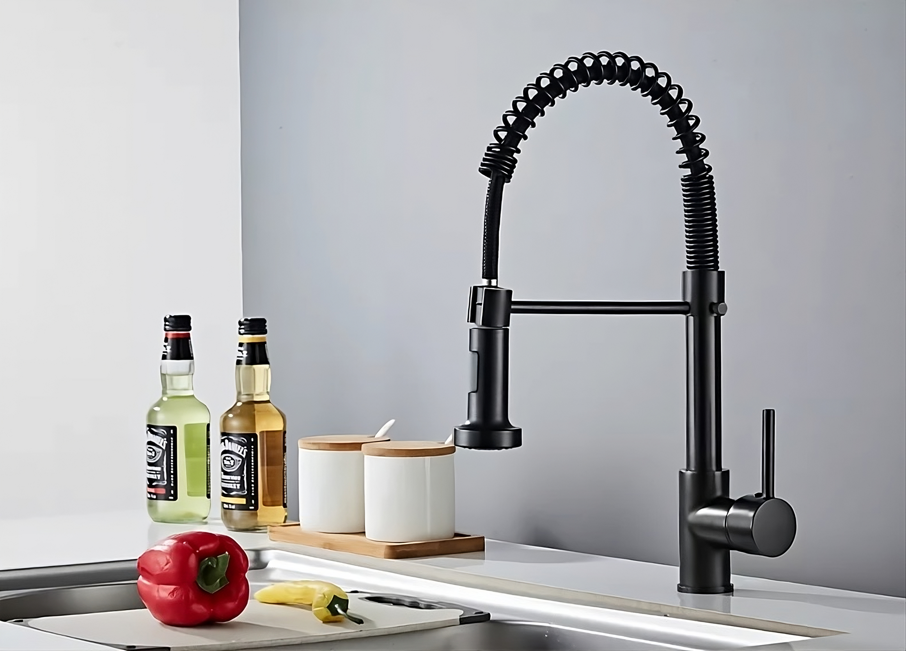 Black single hole kitchen faucet with pull down sprayer. Matte black spring neck kitchen faucet.