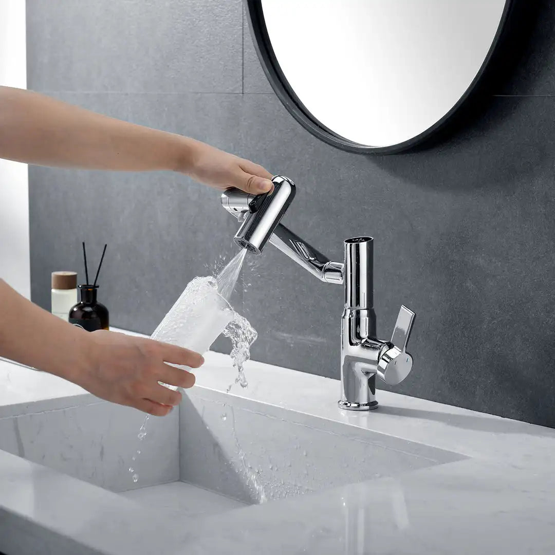 Using chrome Leiden faucet to fill a cup of water in a bathroom