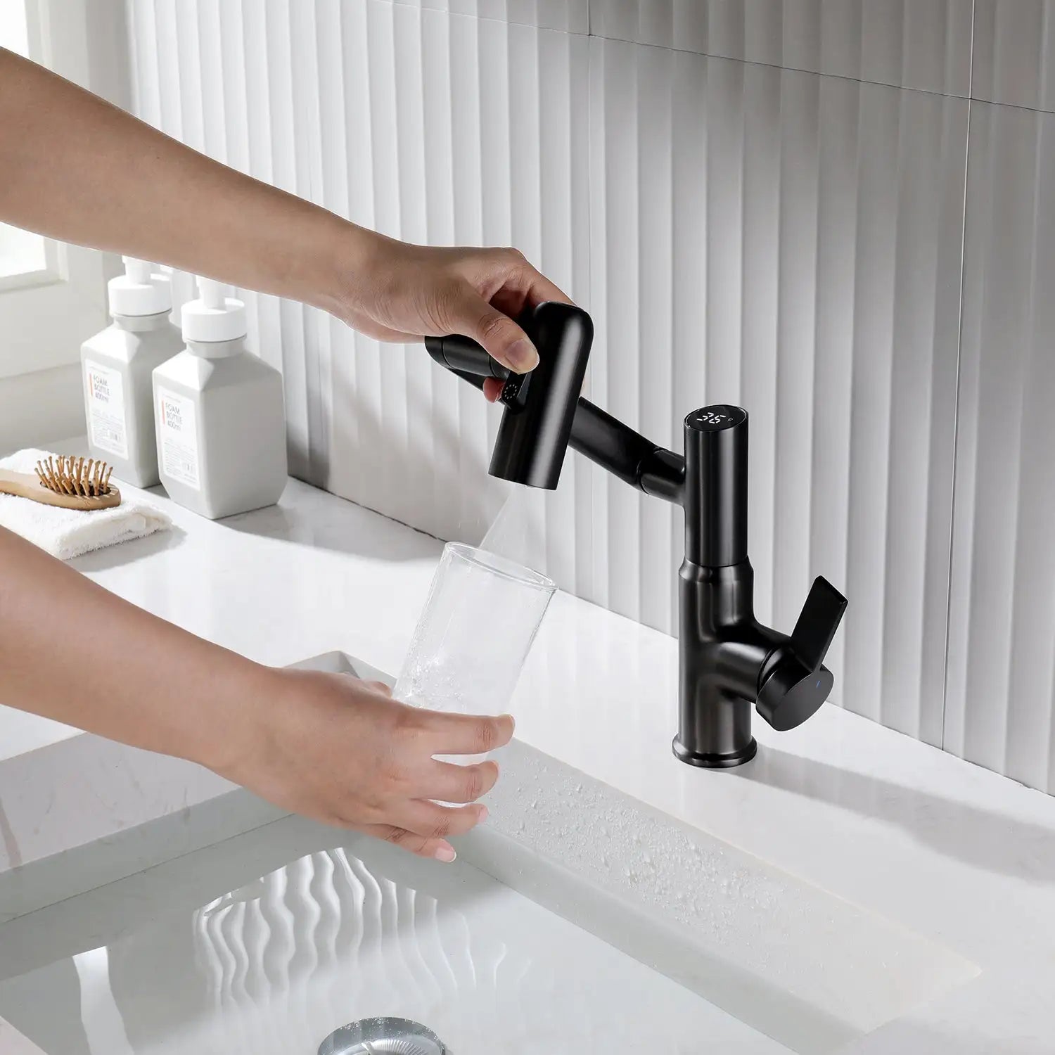 Using black Leiden faucet to fill a cup of water in a bathroom